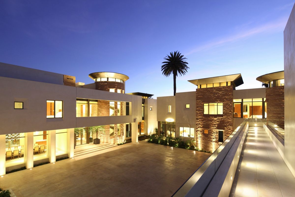 Contemporary hillside luxury estate footbridge view